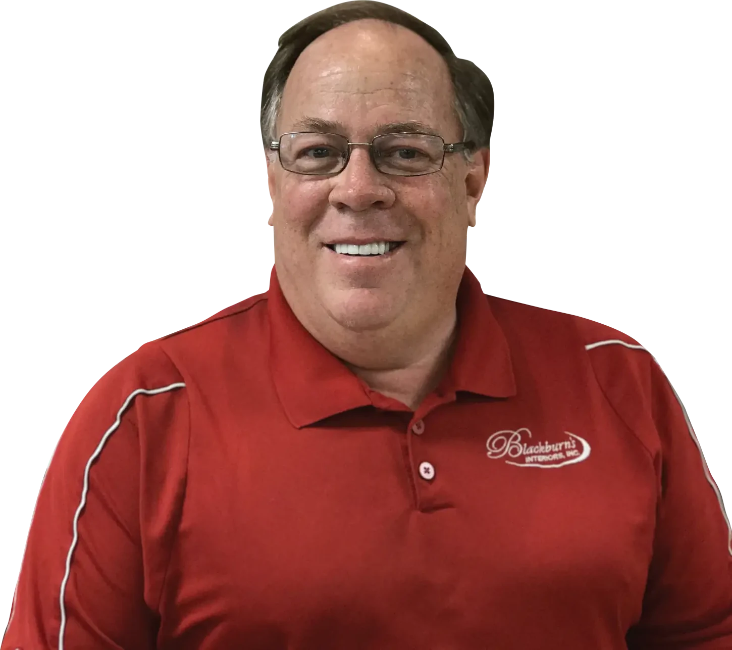 Wally Blackburn, second-generation owner of Blackburn's Interiors, in a red company polo shirt